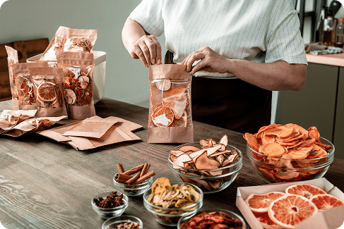 mature-housewife-packing-dried-oranges-pears-per-2025-03-15-07-53-43-utc 1